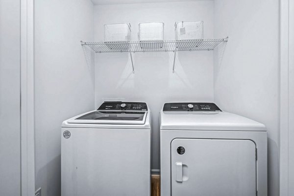 Functional laundry room with modern appliances in Wayford at Pringle Towns Townhomes