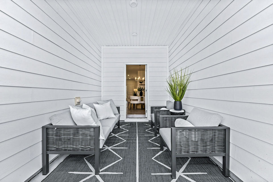 Cozy patio at Wayford at Pringle Towns Townhomes featuring outdoor seating and greenery