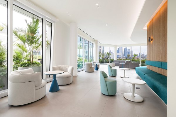 Clubhouse at Hoboken Point Apartments: Modern design with communal seating and entertainment areas for social gatherings and relaxation