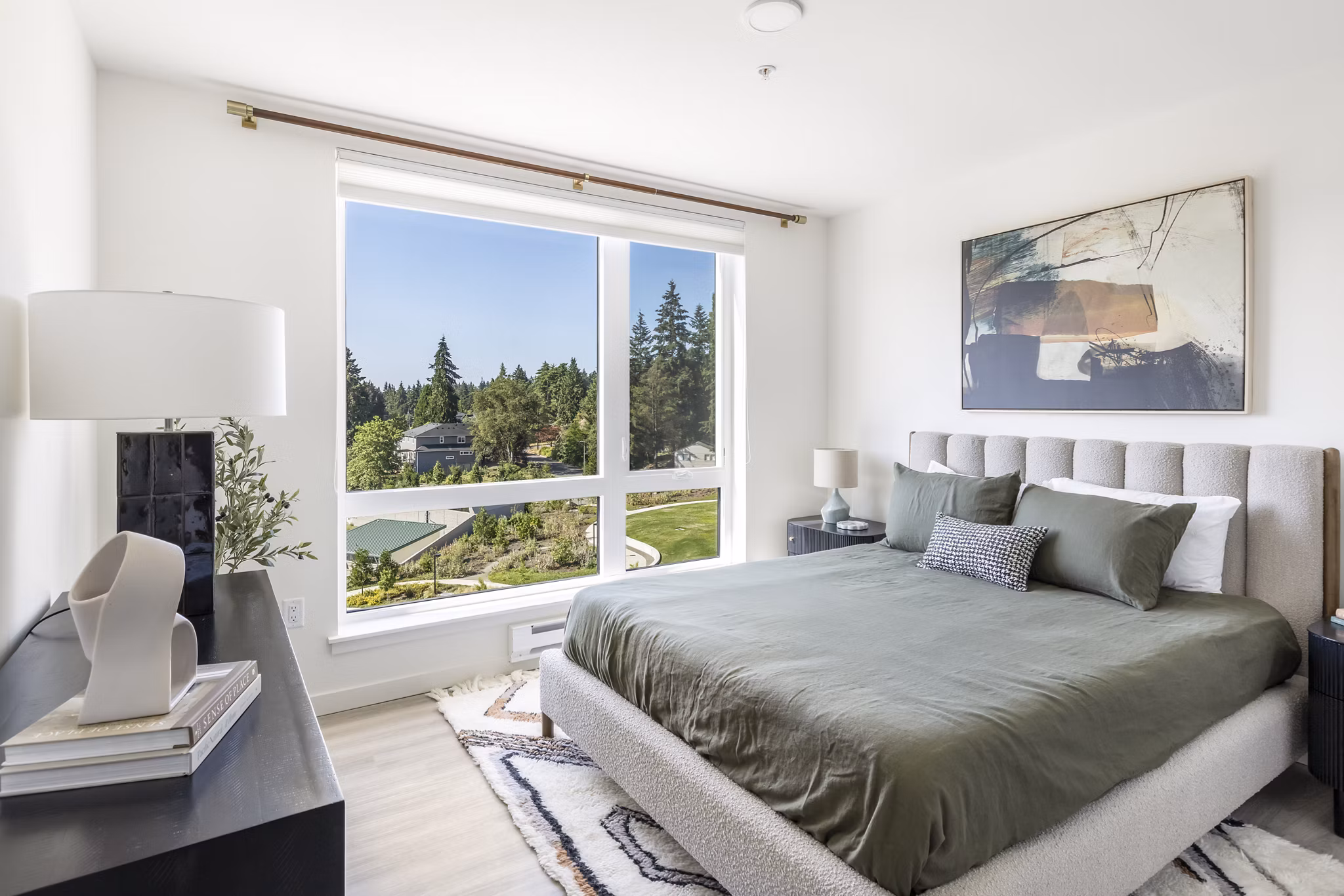 Bedroom with elegant decor at Broadstone Savoie Apartments, featuring cozy bedding and stylish furnishings