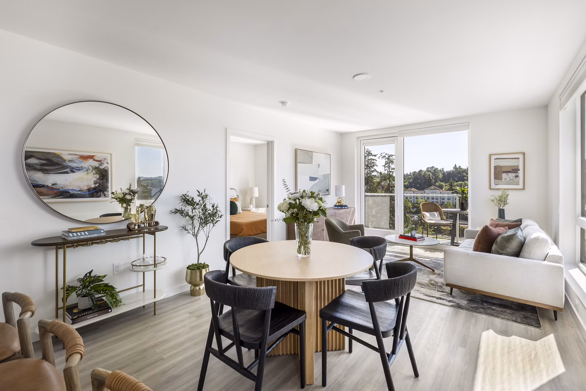 Elegant dining area with modern decor at Broadstone Savoie Apartments, featuring a stylish table set and ambient lighting for luxury living