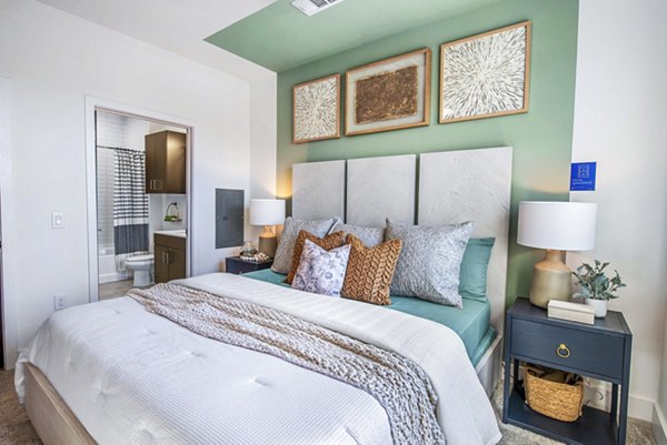 Cozy bedroom with modern furnishings at Alta Washington Apartments