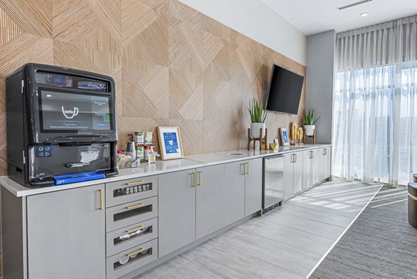 Modern clubhouse with communal seating and stylish decor at Alta Washington Apartments