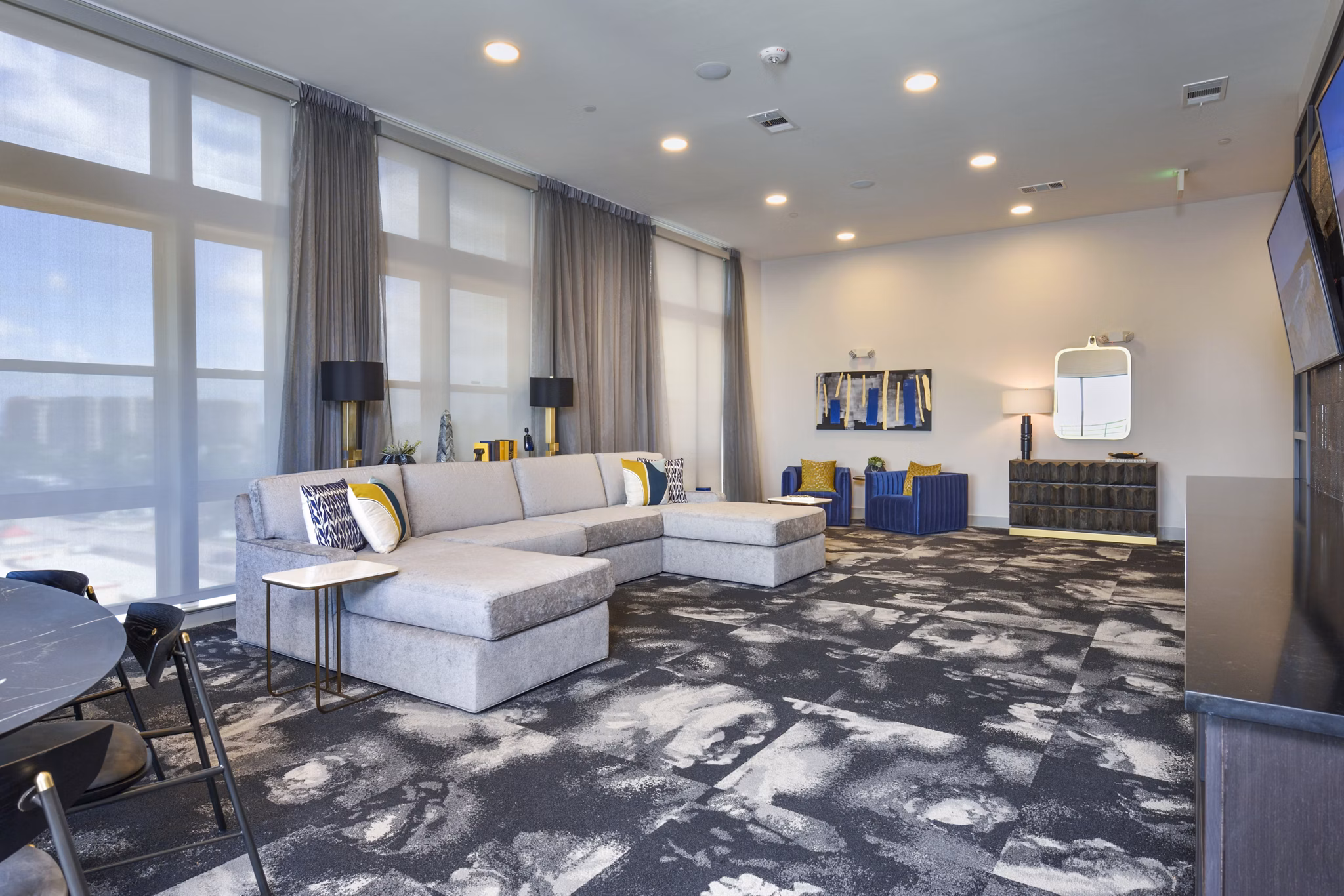 Elegant clubhouse at Alta Washington Apartments featuring modern decor and stylish seating
