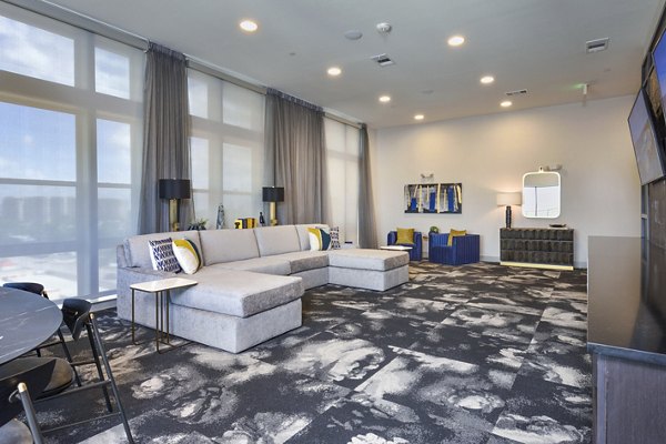 Elegant clubhouse at Alta Washington Apartments featuring modern decor and stylish seating