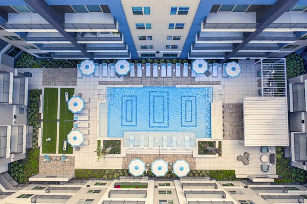 Luxurious poolside retreat at Alta Washington Apartments featuring modern design and comfortable lounging spaces