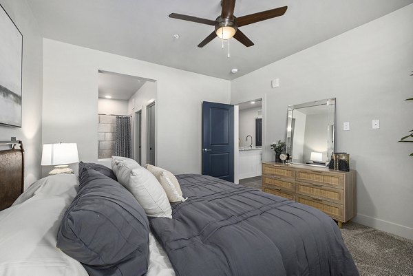 Luxurious bedroom with stylish decor at The Preserve at Mesa Creek Apartments