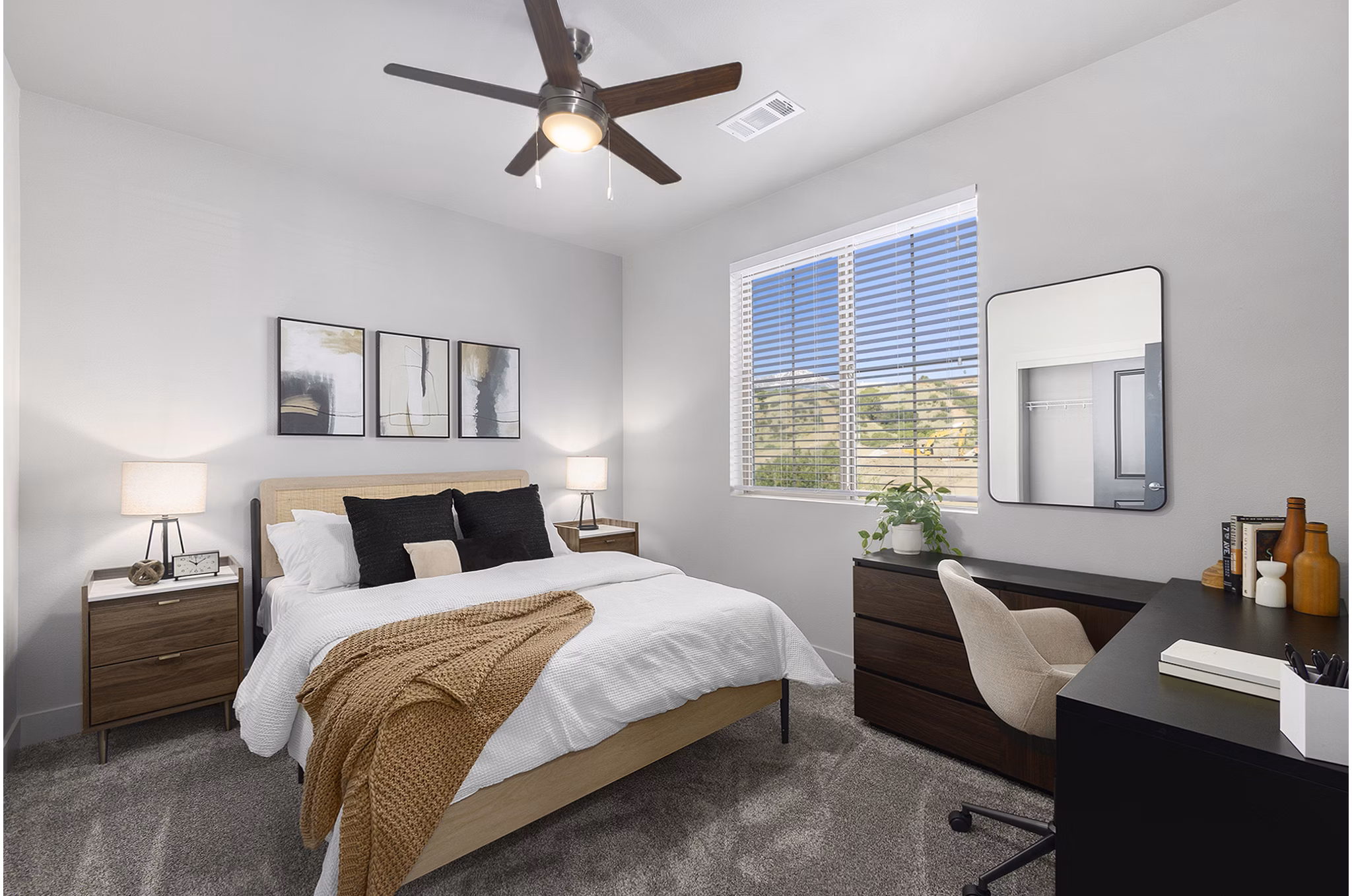 Cozy bedroom with modern decor at The Preserve at Mesa Creek Apartments