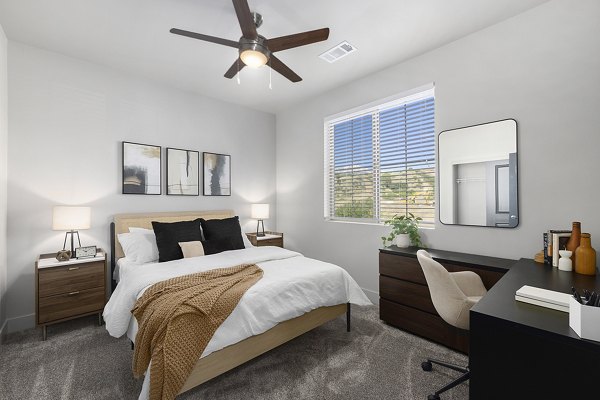 Cozy bedroom with modern decor at The Preserve at Mesa Creek Apartments