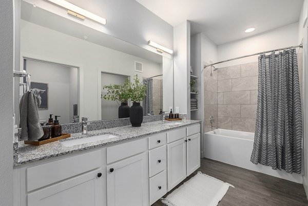 Luxurious bathroom with modern fixtures at The Preserve at Mesa Creek Apartments, offering comfort and style in upscale living spaces