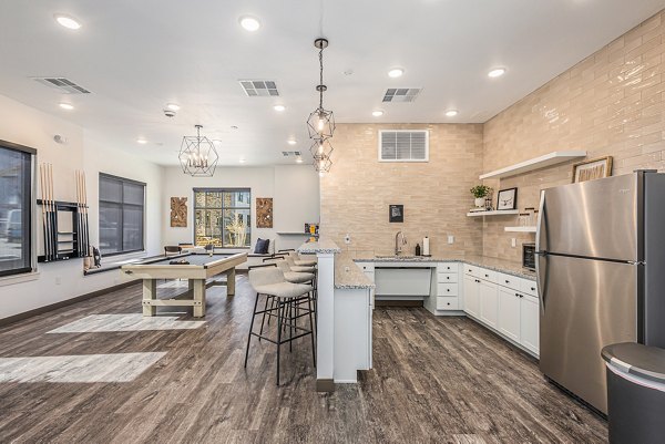Clubhouse with modern decor and seating at The Preserve at Mesa Creek Apartments