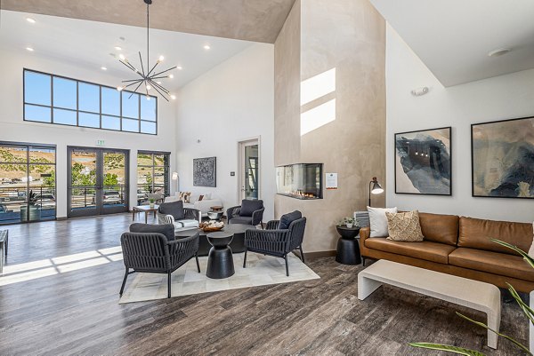 Clubhouse with modern furnishings at The Preserve at Mesa Creek Apartments, a luxury Greystar property featuring community-oriented spaces