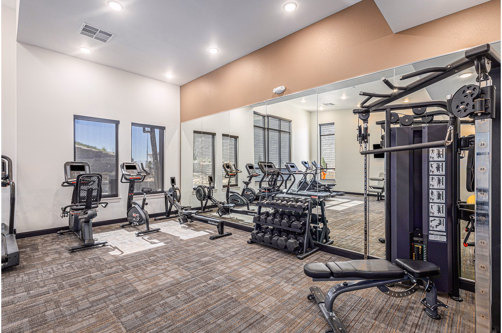 Modern fitness center with state-of-the-art equipment at The Preserve at Mesa Creek Apartments, offering residents a luxury workout experience