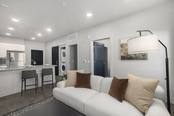 Spacious living room with modern decor at The Preserve at Mesa Creek Apartments