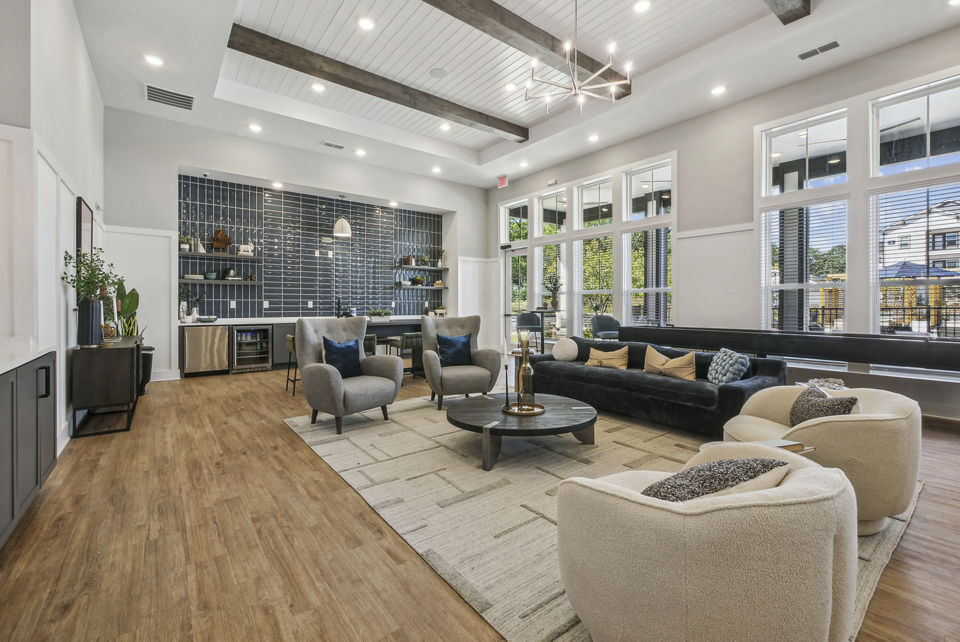 Clubhouse game room with modern furnishings at Advenir at Mallory Lake Apartments