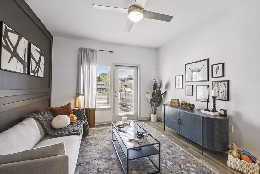 Bright living room with lake views in Advenir at Mallory Lake Apartments
