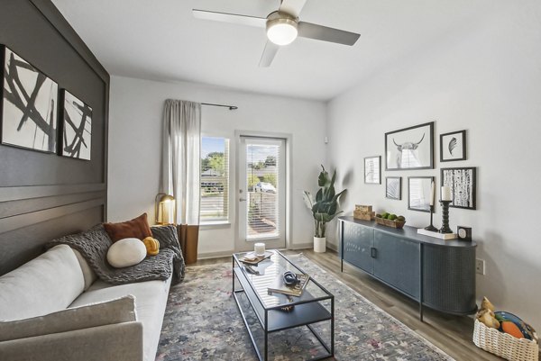 Bright living room with lake views in Advenir at Mallory Lake Apartments