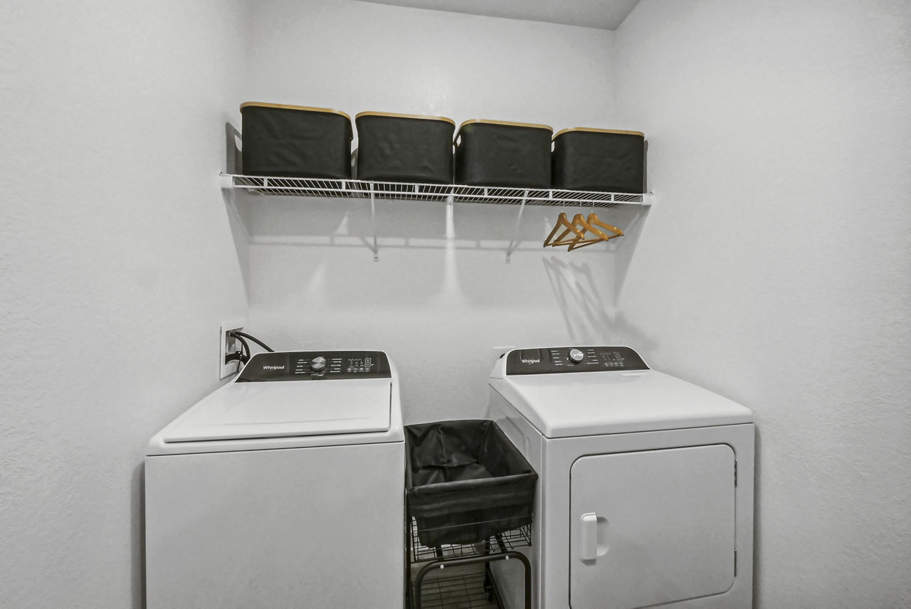 Laundry room at Advenir At Mallory Lake