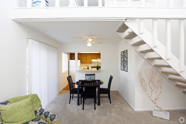 Dining area featuring elegant lighting and modern decor at The Retreat Northwest Apartments