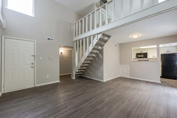 Cozy kitchen with sleek countertops and modern appliances in The Retreat Northwest Apartments