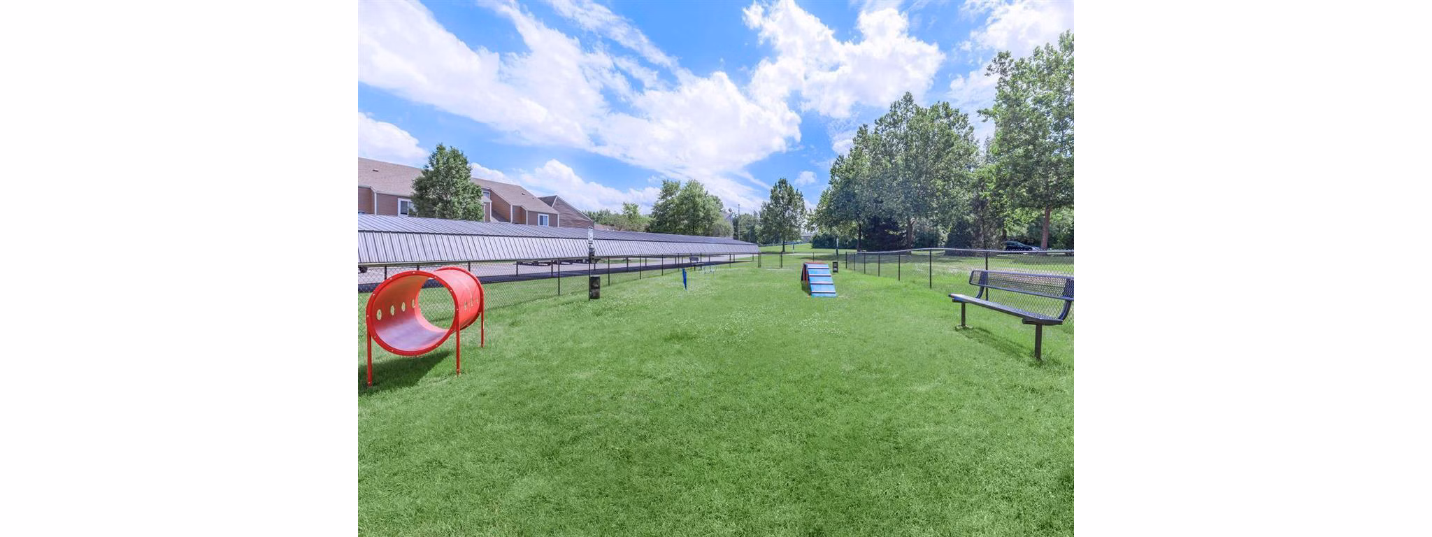 Dog park with agility equipment at The Retreat Northwest Apartments for pet-friendly living