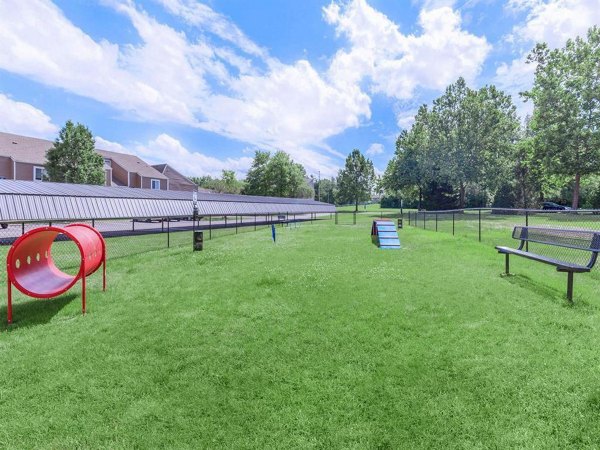 Dog park with agility equipment at The Retreat Northwest Apartments for pet-friendly living