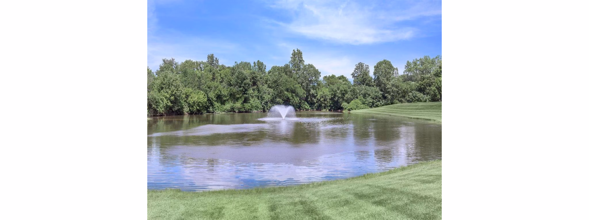 The Retreat Northwest: View of landscaped grounds with spacious, luxury apartments, ideal for relaxation and recreation
