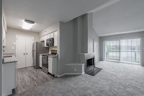 Modern kitchen with sleek countertops and stainless steel appliances in Wylde at Eagle Creek Apartments