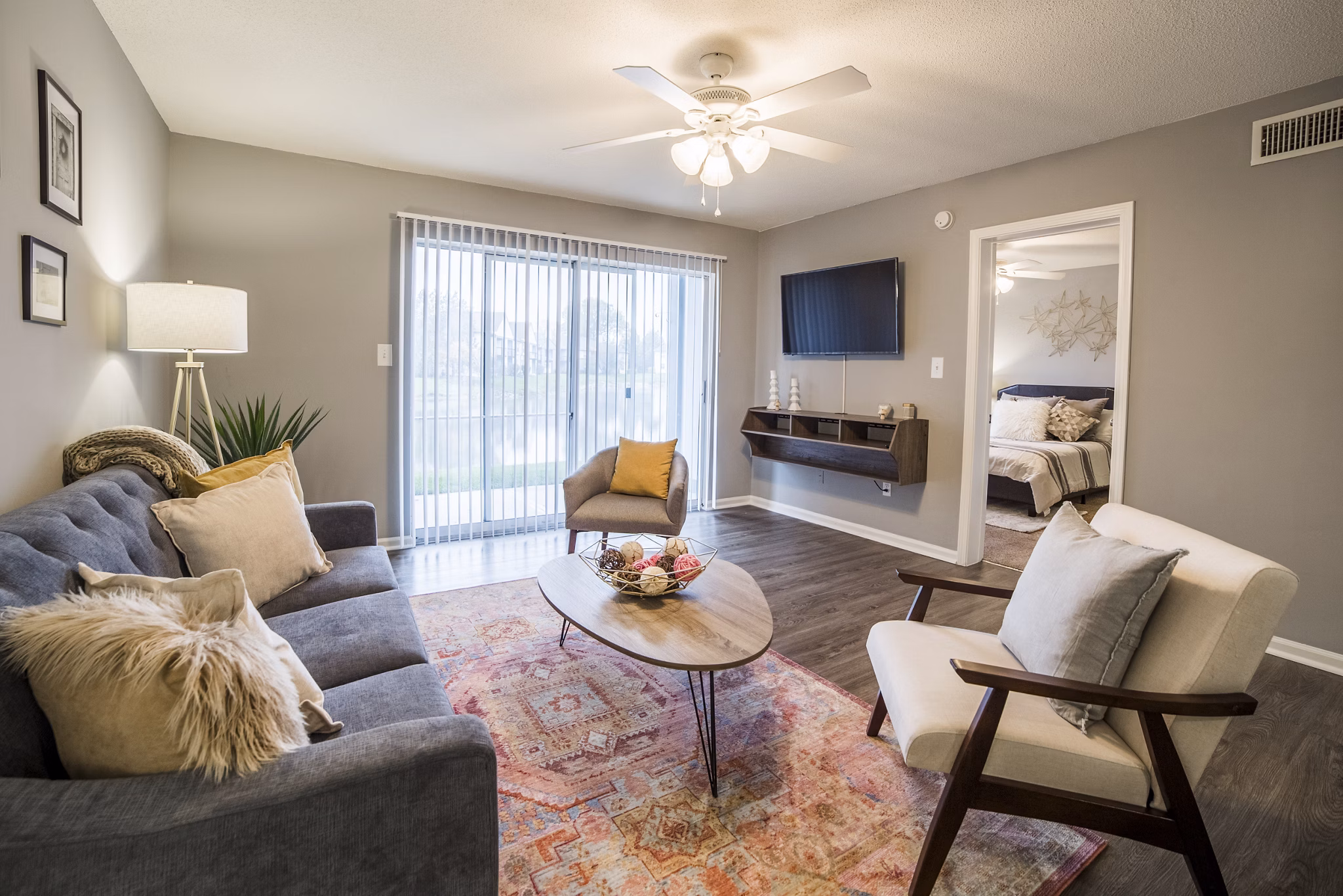 Spacious living room with modern decor in Wylde at Eagle Creek Apartments