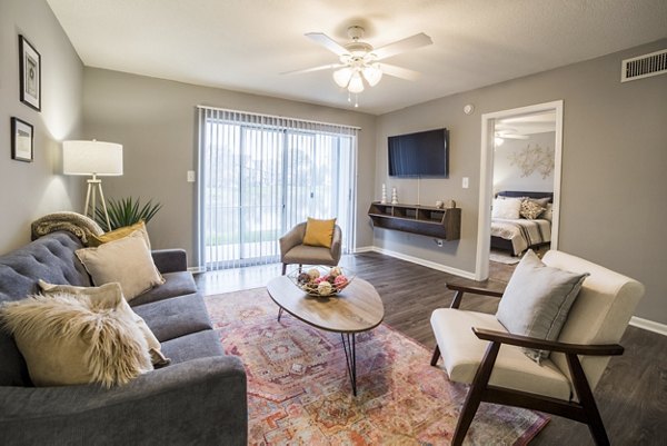 Spacious living room with modern decor in Wylde at Eagle Creek Apartments