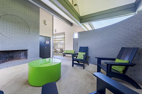 Fire pit lounge area at Wylde at Eagle Creek Apartments, offering cozy outdoor seating for relaxation and social gatherings