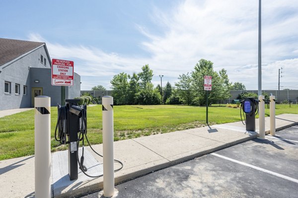 Car charging station at Wylde at Eagle Creek Apartments providing eco-friendly amenities