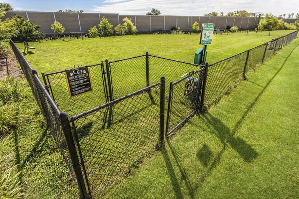 Spacious dog park with agility equipment at Wylde at Eagle Creek Apartments