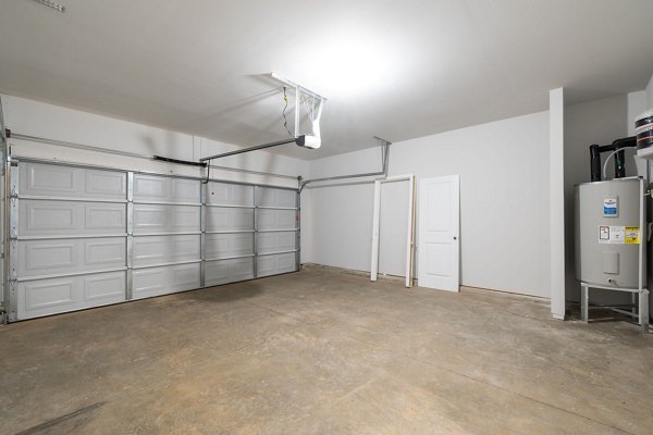 Enclosed parking garage at Smith Crossing Apartments offering secure vehicle storage for residents