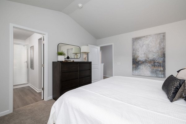 Modern bedroom featuring elegant decor and ample natural light at Smith Crossing Apartments in luxury accommodation style