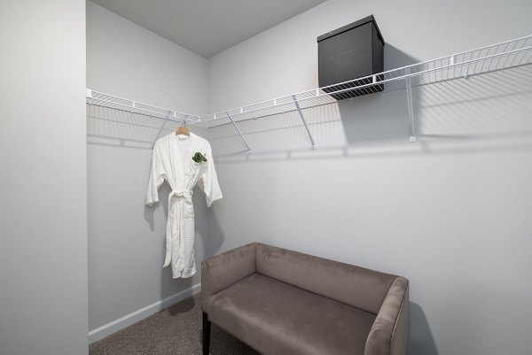 Walk-in closet with ample storage space at Smith Crossing Apartments
