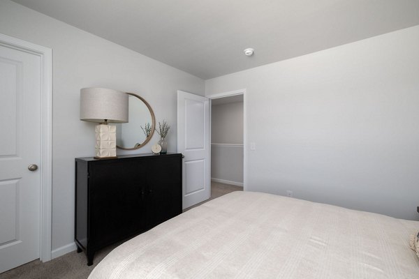Cozy bedroom with elegant decor at Smith Crossing Apartments