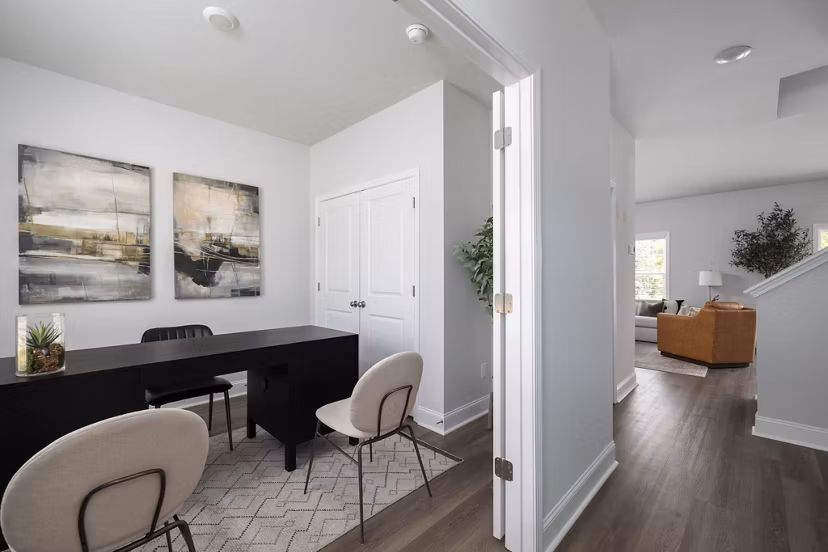 Home office with modern ergonomic desk and chair in Spire at Smith Crossing Apartments