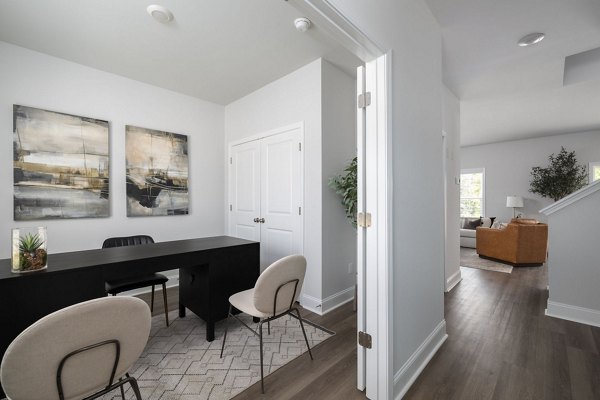 Home office with modern ergonomic desk and chair in Spire at Smith Crossing Apartments