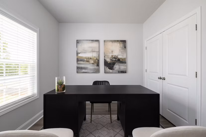 Modern home office with ergonomic chair and built-in desk in Spire at Smith Crossing Apartments