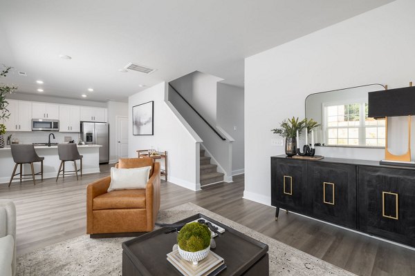 Modern living room with elegant decor at Spire at Smith Crossing Apartments, featuring luxury finishes and open space design