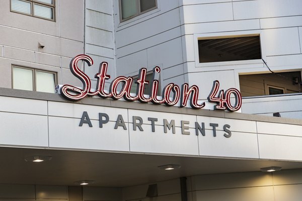 Station 40: Modern luxury apartment with sleek facade in vibrant city setting