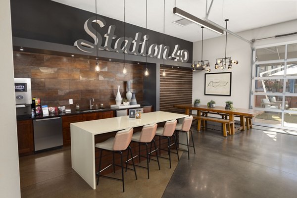 Modern lounge area with a counter and bar stools at Station 40