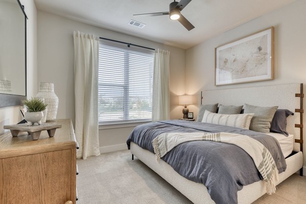 Bedroom featuring modern furnishings and natural light at Lenox Grandview Apartments