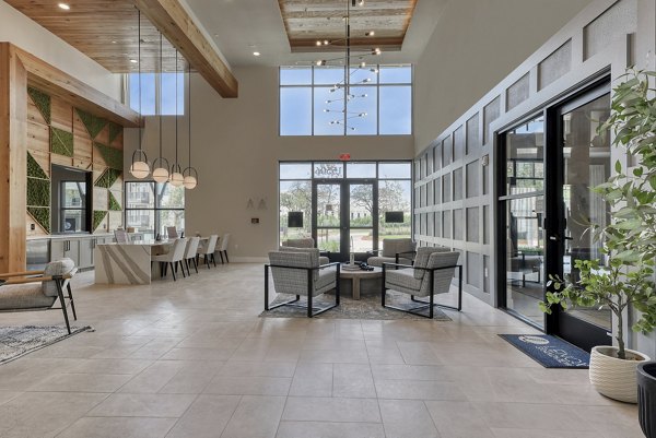Clubhouse with modern furnishings and open design at Lenox Grandview Apartments