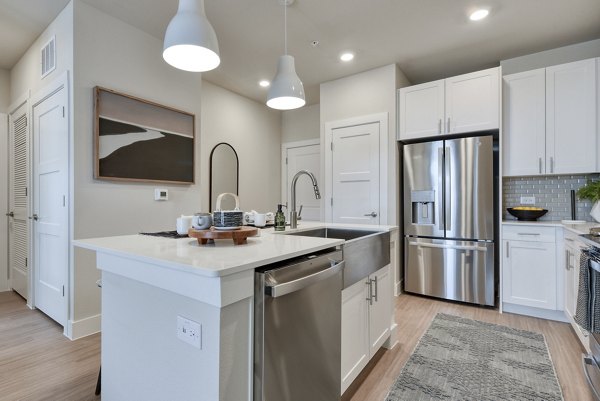 Modern kitchen featuring stainless steel appliances at Lenox Grandview Apartments