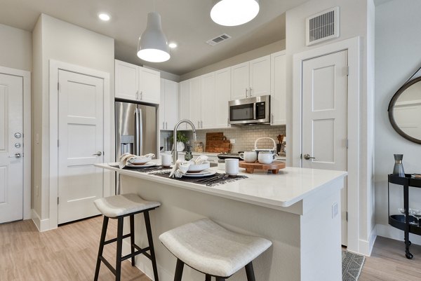 Modern kitchen with stainless steel appliances at Lenox Grandview Apartments