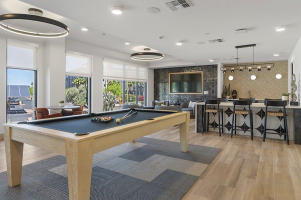 Vero Tempe Apartments: Modern clubhouse featuring stylish seating areas and billiards table in luxury apartment community