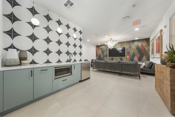 Clubhouse featuring a modern design with communal seating and entertainment options at Vero Tempe Apartments luxury residences