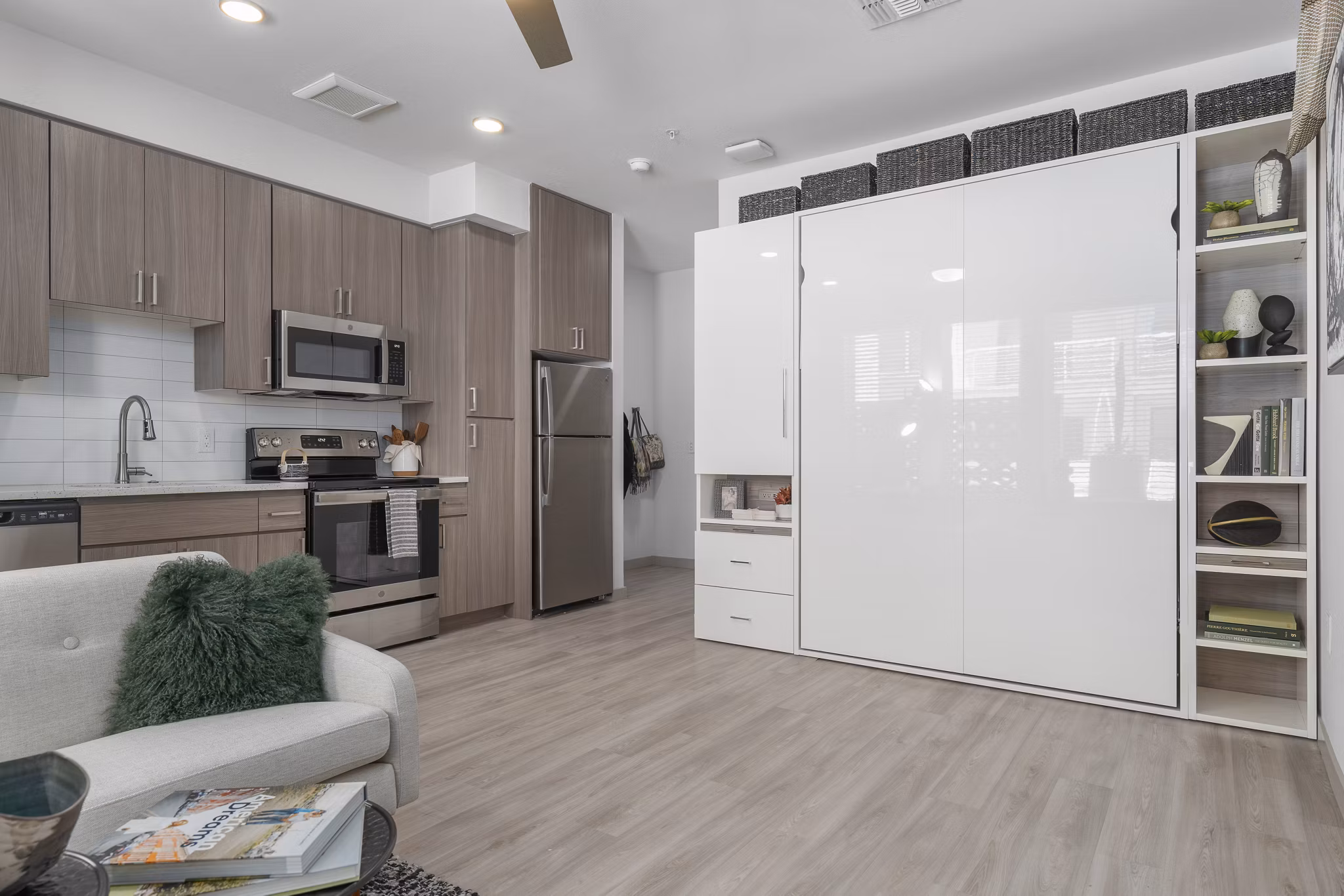 Bright kitchen with modern appliances and granite countertops in Vero Tempe Apartments